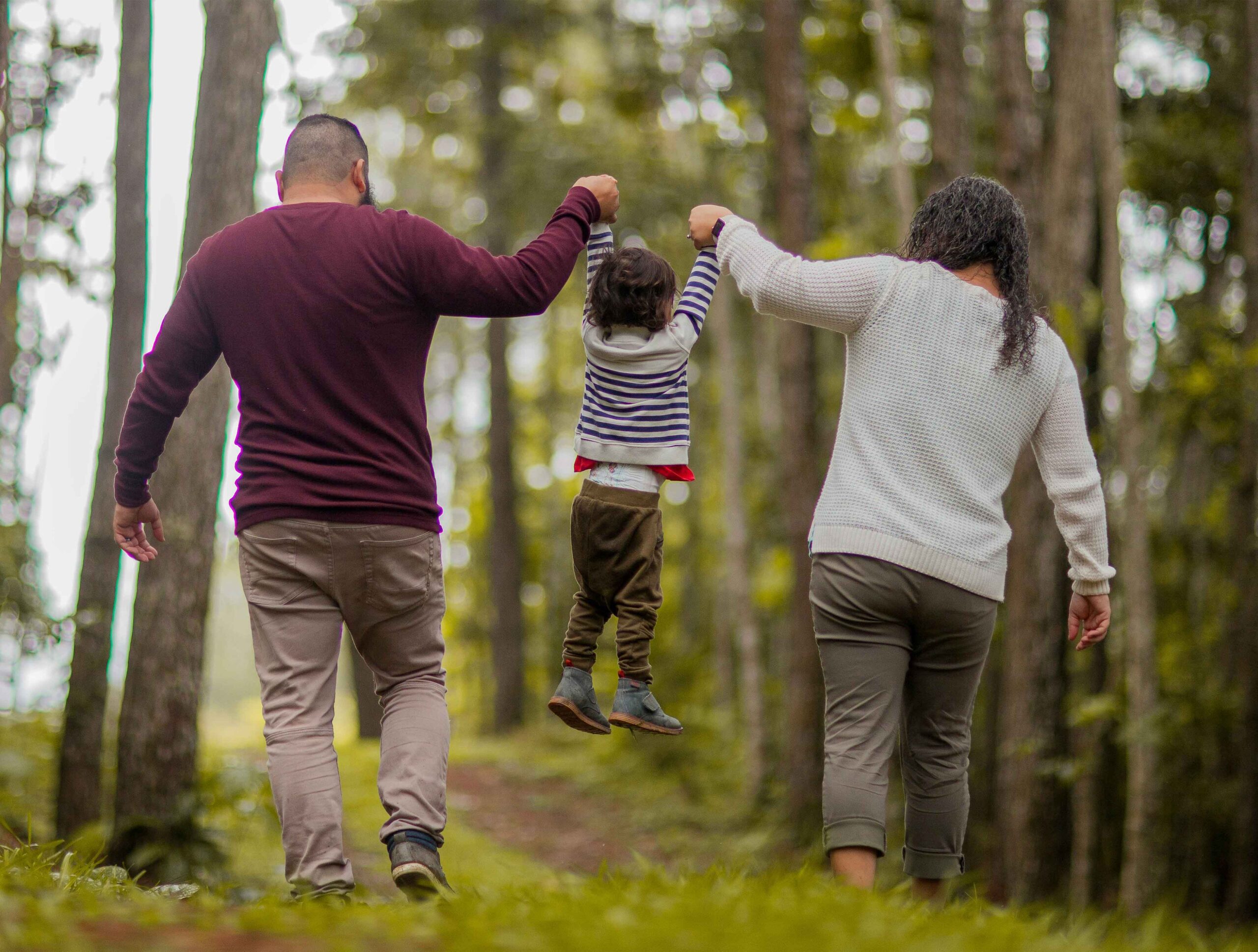 Family together, illustrating the safe and nurturing environment Heartland Ranch provides for children healing from trafficking. Learn about our mission: to provide a safe, healthy, and nurturing environment for children who have endured the unimaginable — the trauma of trafficking.