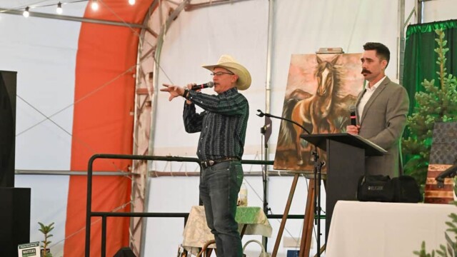 Auctioneers announcing from stage